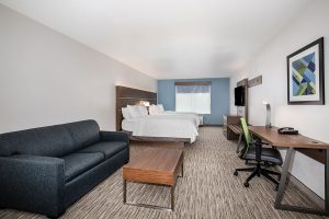 guest room with two queen beds and sofa